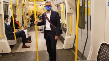 Mayor of London Sadiq Khan wears a face covering as he travels on the Tube